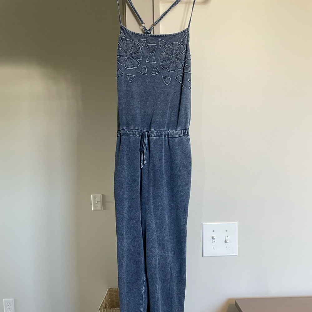 Soft blue jumpsuit with flower details